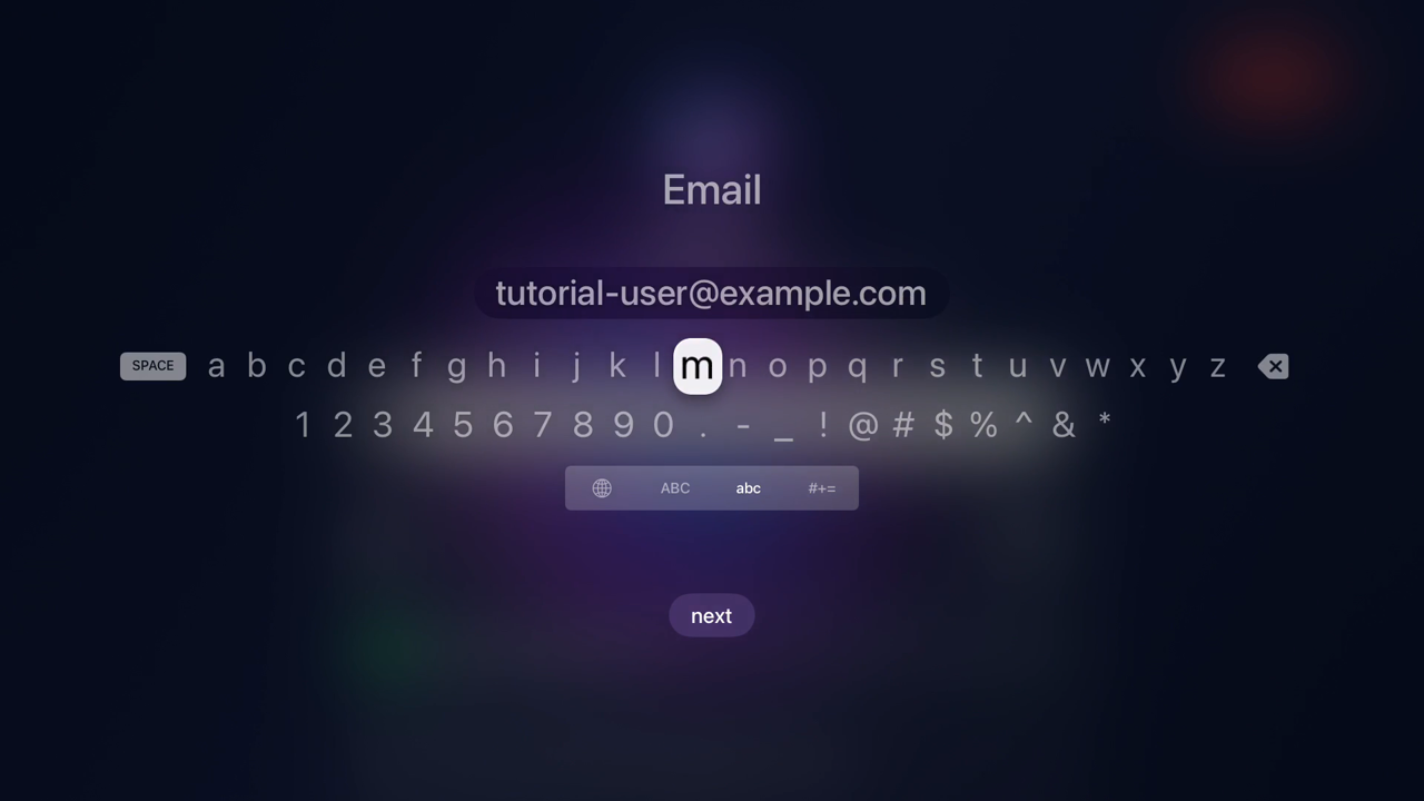 The tvOS on-screen keyboard under the heading 